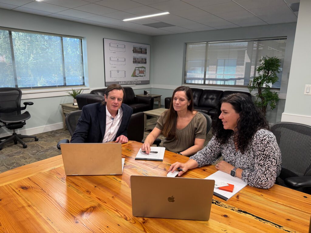 Tracey and Steph discuss strategy with a consulting client.